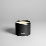 Hinoki candle in a black minimalist tin, featuring a rich, resinous wood aroma with a distinctive brightness. Infused with blue cypress, rose, yuzu, and balanced essential oils for a fresh, welcoming scent. Made with coconut/soy wax, essential oils, and botanical extracts.