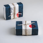 Cold-pressed soap bar made with activated charcoal, ground breu resin, and essential oils of rosemary, pine fir, cedarwood, and patchouli.