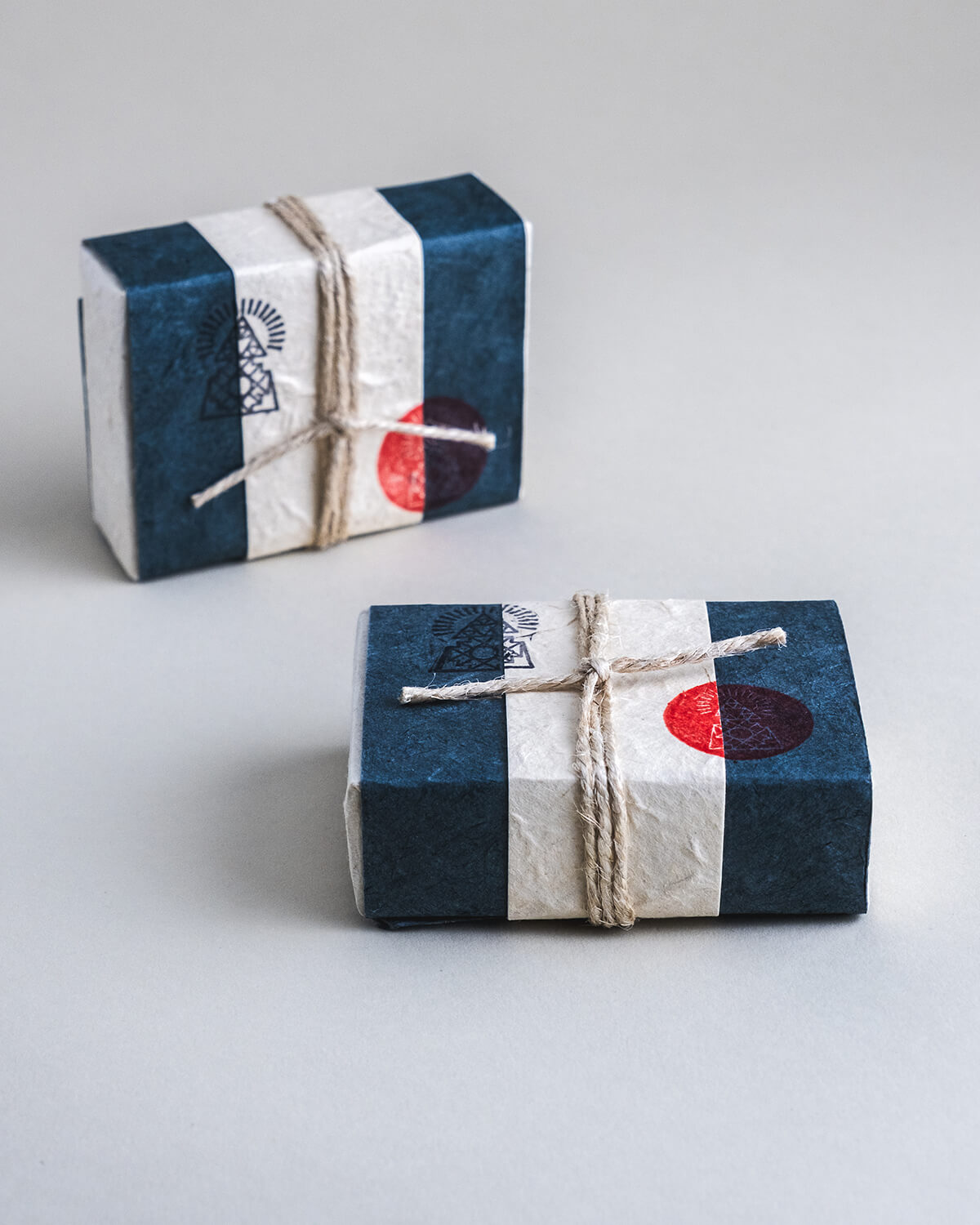 Cold-pressed soap bar made with activated charcoal, ground breu resin, and essential oils of rosemary, pine fir, cedarwood, and patchouli.