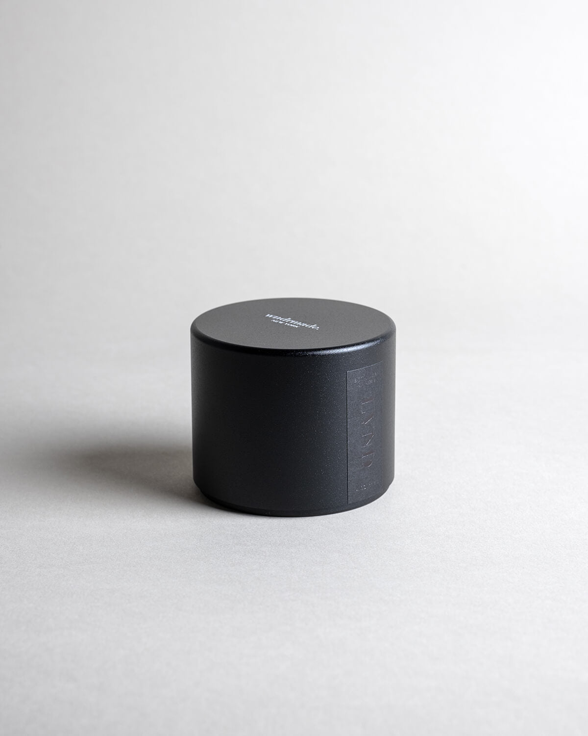 Lavender candle in a black minimalist tin, featuring pure French lavender with a soft, powdery aroma, woody balsamic heart notes, and herbaceous top notes. No synthetics, just the real thing. Made with coconut/soy wax, essential oils, and botanical extracts.