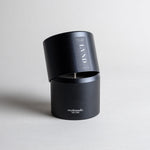 Lavender candle in a black minimalist tin, featuring pure French lavender with a soft, powdery aroma, woody balsamic heart notes, and herbaceous top notes. No synthetics, just the real thing. Made with coconut/soy wax, essential oils, and botanical extracts.