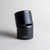 Lavender candle in a black minimalist tin, featuring pure French lavender with a soft, powdery aroma, woody balsamic heart notes, and herbaceous top notes. No synthetics, just the real thing. Made with coconut/soy wax, essential oils, and botanical extracts.