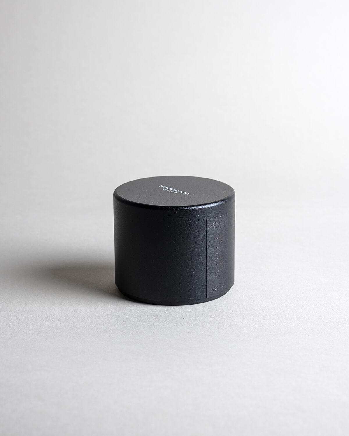 Patchouli candle in a black minimialist tin, crafted with frankincense, juniper berry, jasmine, and more. A deep, sophisticated, and timeless aroma that redefines this enigmatic scent. Made with coconut/soy wax, essential oils, and botanical extracts.
