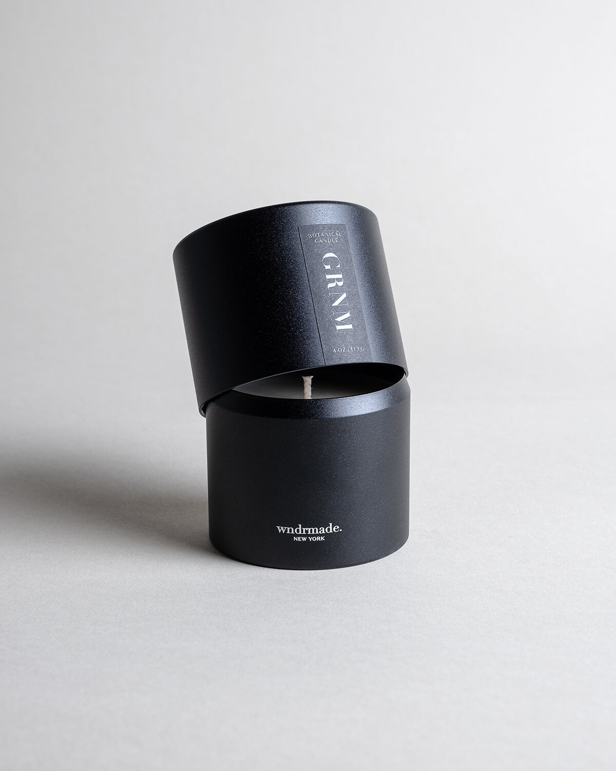 Geranium candle in a black minimalist tin, offering a fresh floral geranium aroma with calming vibes and natural insect-repelling properties. Perfect for summer nights, a beach house, or a cabin in the woods. Made with coconut/soy wax, essential oils, and botanical extracts.