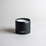 ATLAS candle in a black minimalist tin, evoking a dreamy walk through Moroccan cedar forests with a light citrus blossom breeze. A soft, woodsy, and mildly sweet design, crafted to calm the mind. Made with coconut/soy wax, essential oils, and botanical extracts.