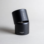 Palo Santo candle in a black minimalist tin, featuring a calming, meditative fragrance made with true Ecuadorian Palo Santo oil. Cleanses, inspires creativity, and embodies the spirit of renewal. Made with coconut/soy wax, essential oils, and botanical extracts.