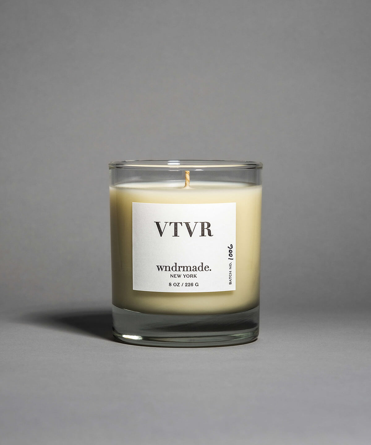 Vetiver candle in a clear heavy base glass, featuring a soft, warm, and cozy aroma, reminiscent of your favorite cashmere sweater. A comforting scent that creates a soothing atmosphere for moments of pure relaxation. Made with coconut/soy wax, essential oils, and botanical extracts.