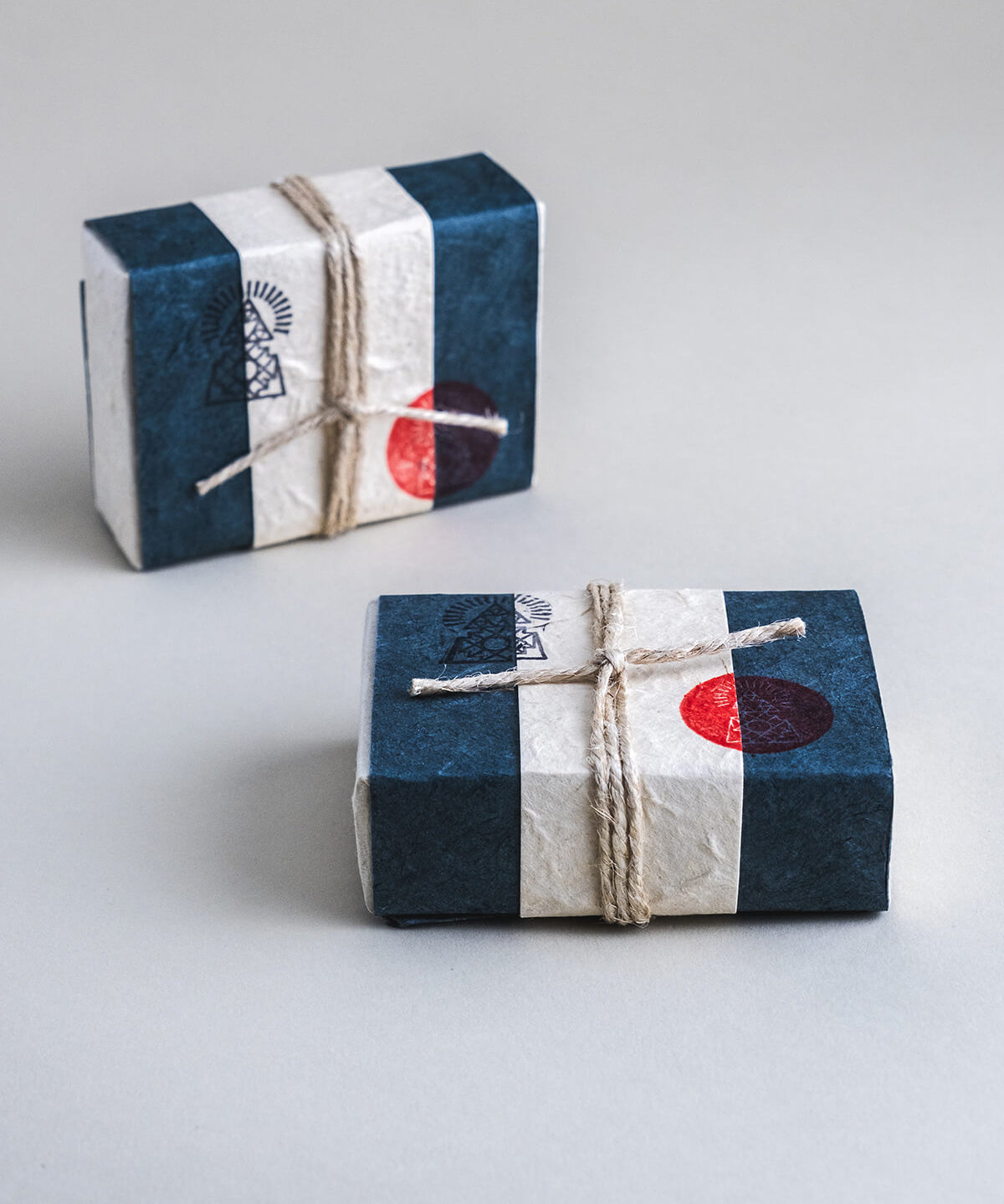 Cold-pressed soap bar made with activated charcoal, ground breu resin, and essential oils of rosemary, pine fir, cedarwood, and patchouli.