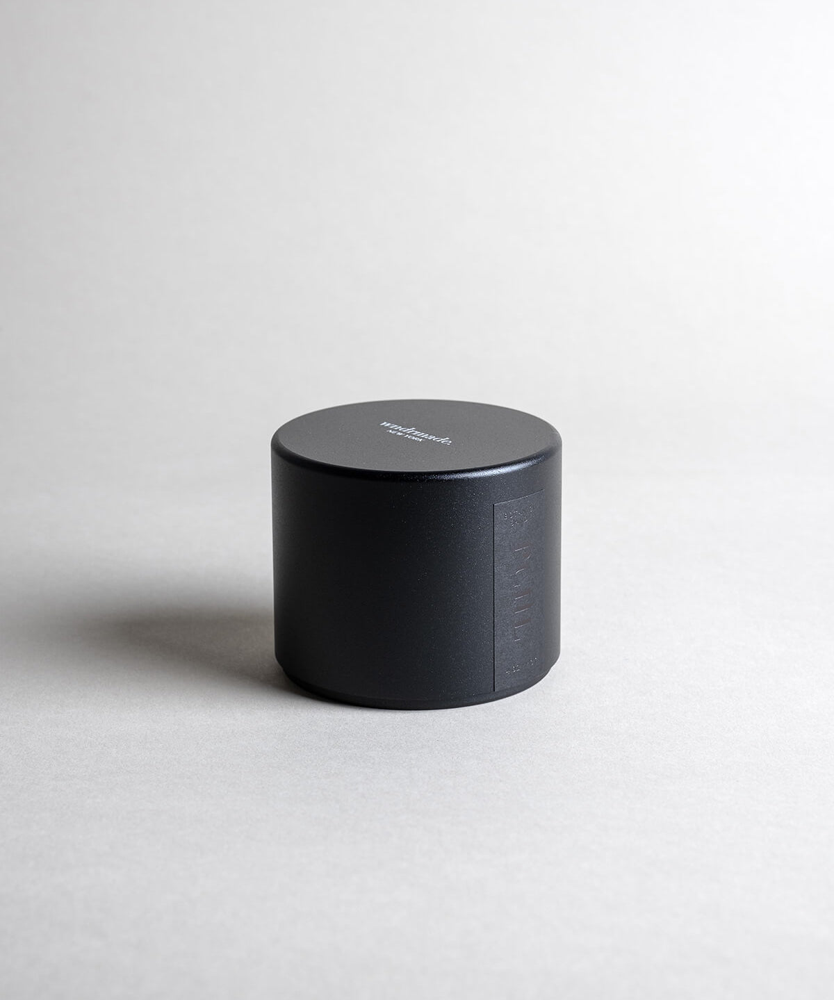 Patchouli candle in a black minimialist tin, crafted with frankincense, juniper berry, jasmine, and more. A deep, sophisticated, and timeless aroma that redefines this enigmatic scent. Made with coconut/soy wax, essential oils, and botanical extracts.