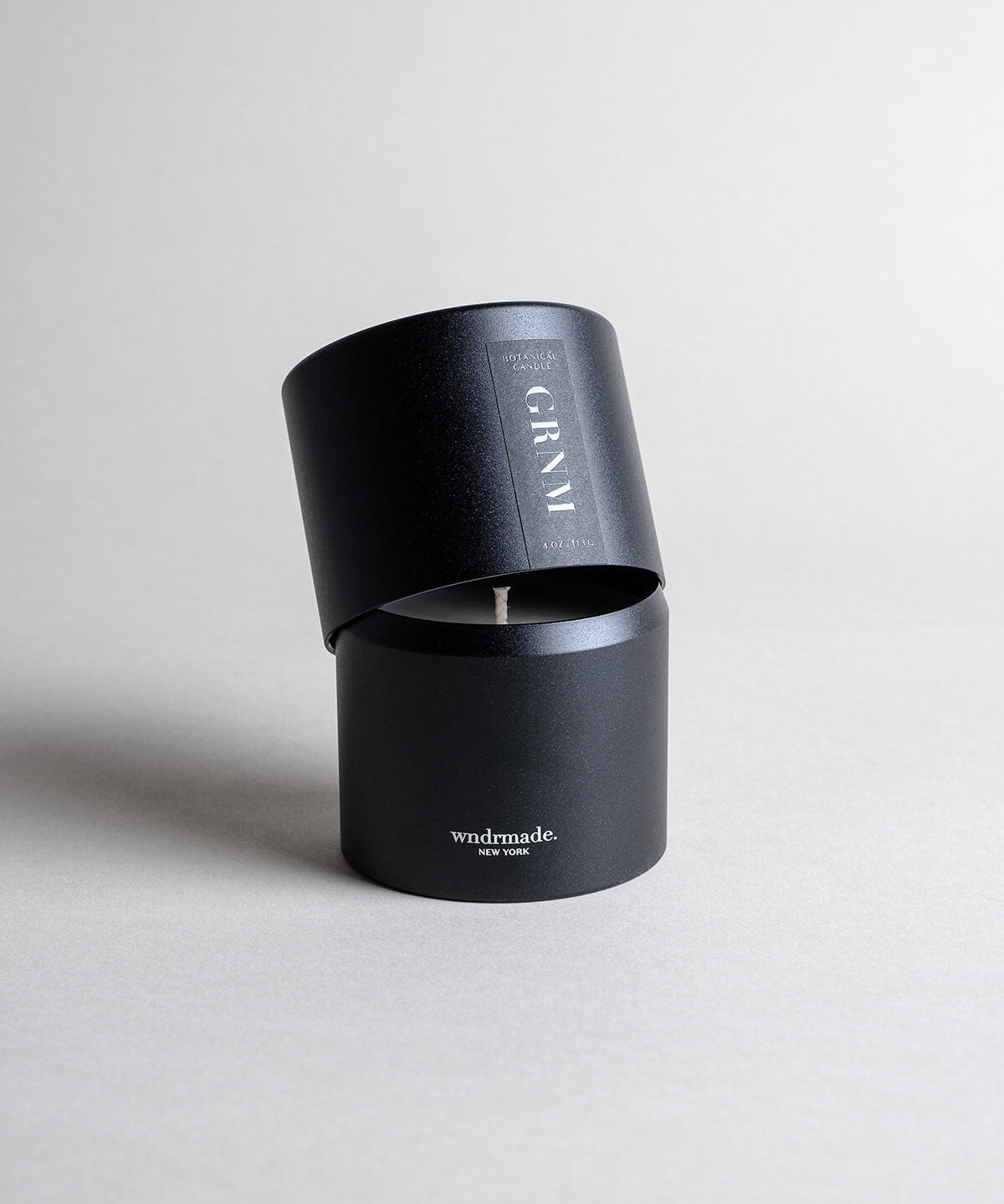 Geranium candle in a black minimalist tin, offering a fresh floral geranium aroma with calming vibes and natural insect-repelling properties. Perfect for summer nights, a beach house, or a cabin in the woods. Made with coconut/soy wax, essential oils, and botanical extracts.