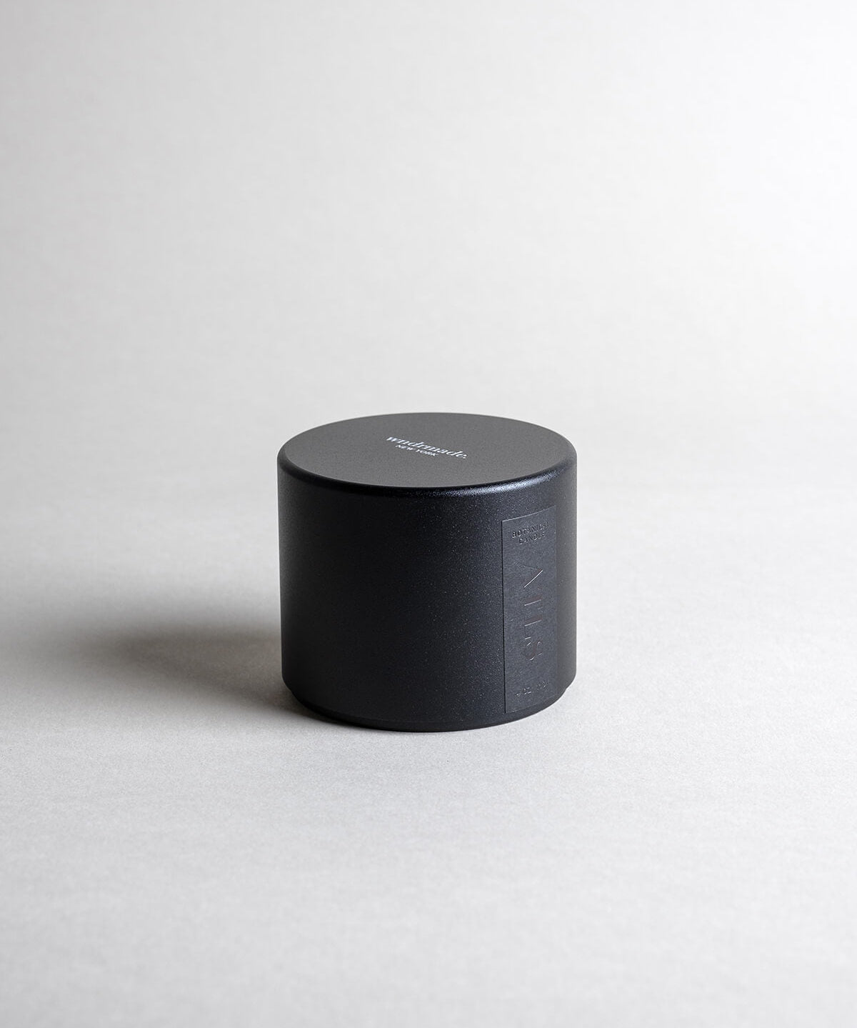 ATLAS candle in a black minimalist tin, evoking a dreamy walk through Moroccan cedar forests with a light citrus blossom breeze. A soft, woodsy, and mildly sweet design, crafted to calm the mind. Made with coconut/soy wax, essential oils, and botanical extracts.